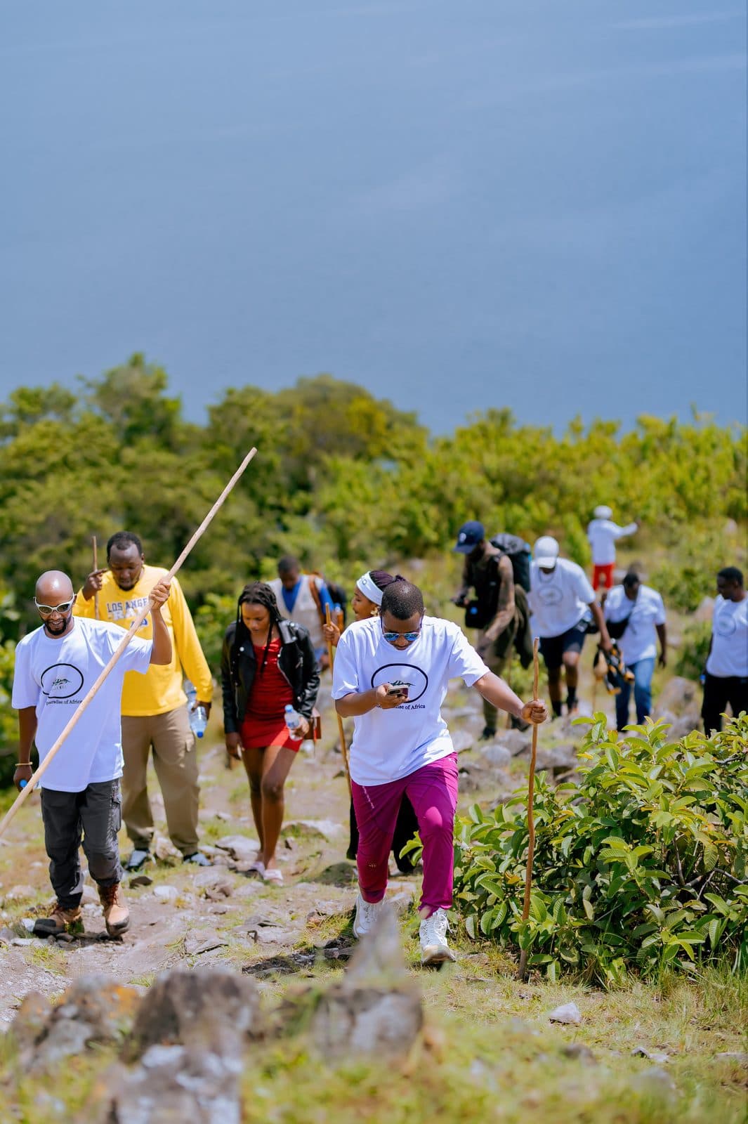 Cooperative members clearing and planting along the Lake Kivu shoreline